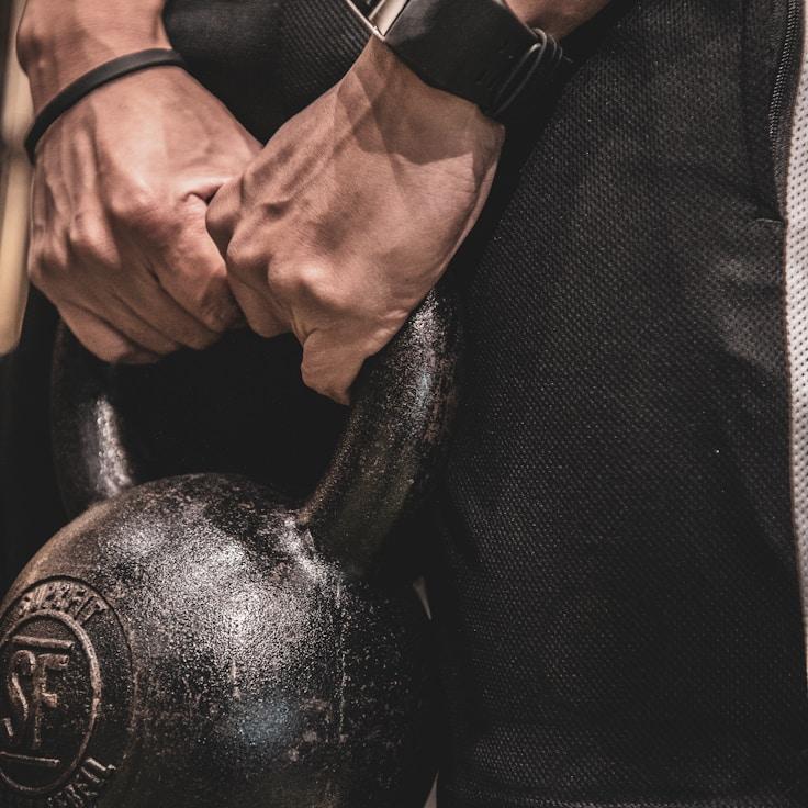 Interior of a professional gym with weight training equipment and mirrors
